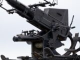 A close-up view of an old anti-aircraft gun.