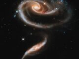 two spiral galaxy like objects in the sky